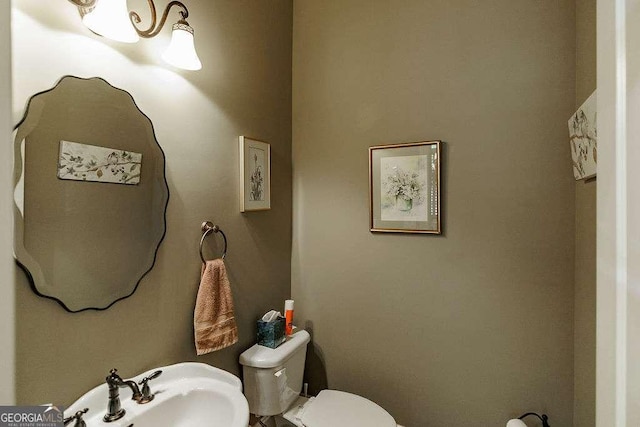 2052 Trimleston Rd, Statham, GA 30666 - half bathroom featuring toilet and a sink