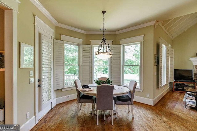 2052 Trimleston Rd, Statham, GA 30666 - dining room featuring wood finished floors, crown molding, and a chandelier