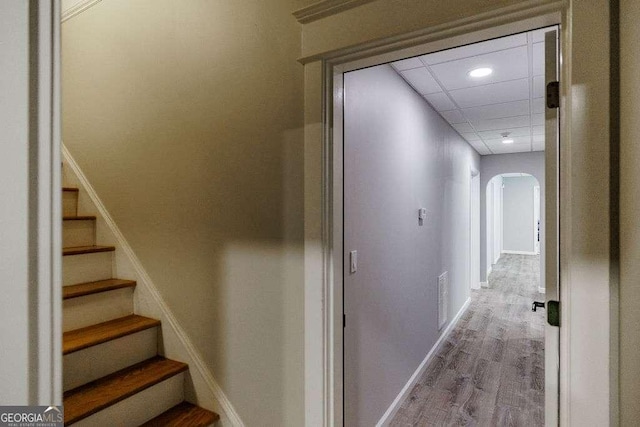 2052 Trimleston Rd, Statham, GA 30666 - corridor with arched walkways, wood finished floors, stairs, a drop ceiling, and recessed lighting