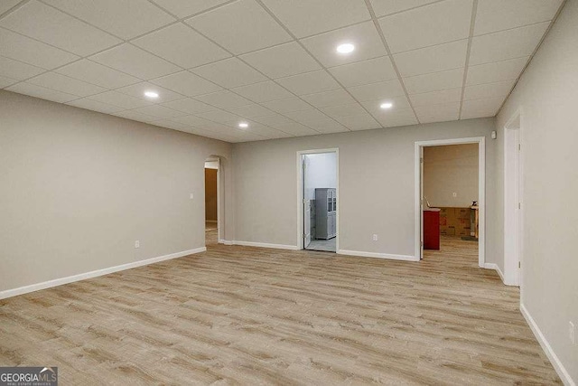 2052 Trimleston Rd, Statham, GA 30666 - unfurnished room featuring light wood-type flooring, arched walkways, a paneled ceiling, and recessed lighting