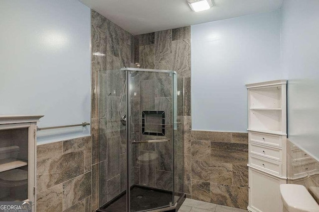 2052 Trimleston Rd, Statham, GA 30666 - full bathroom featuring tile walls, a stall shower, and a wainscoted wall