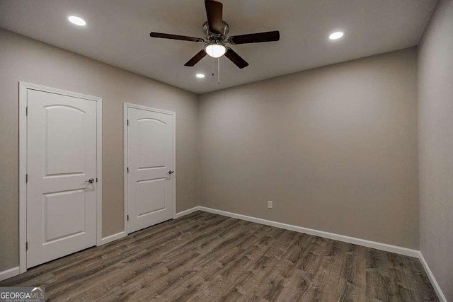2052 Trimleston Rd, Statham, GA 30666 - unfurnished bedroom featuring dark wood-type flooring, recessed lighting, and ceiling fan