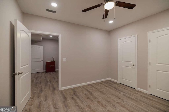 2052 Trimleston Rd, Statham, GA 30666 - empty room featuring wood finished floors, ceiling fan, and recessed lighting