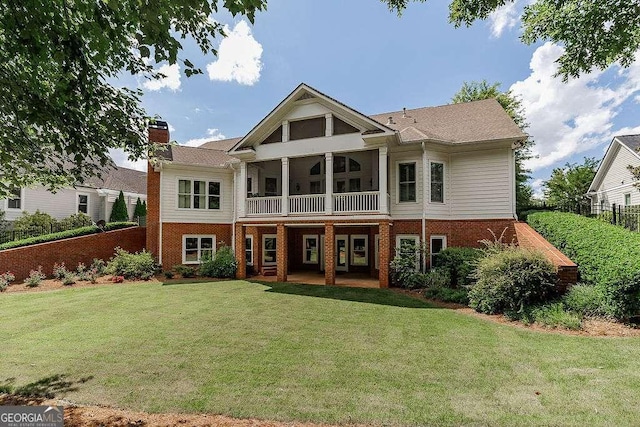 2052 Trimleston Rd, Statham, GA 30666 - rear view of house with brick siding, a chimney, and a patio