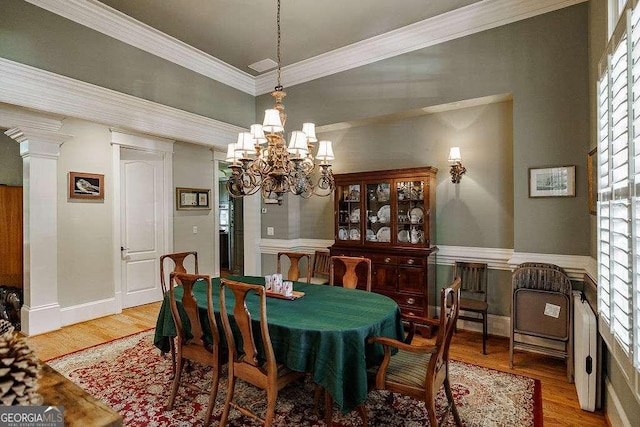 2052 Trimleston Rd, Statham, GA 30666 - dining space with a chandelier, wood finished floors, healthy amount of natural light, and ornamental molding