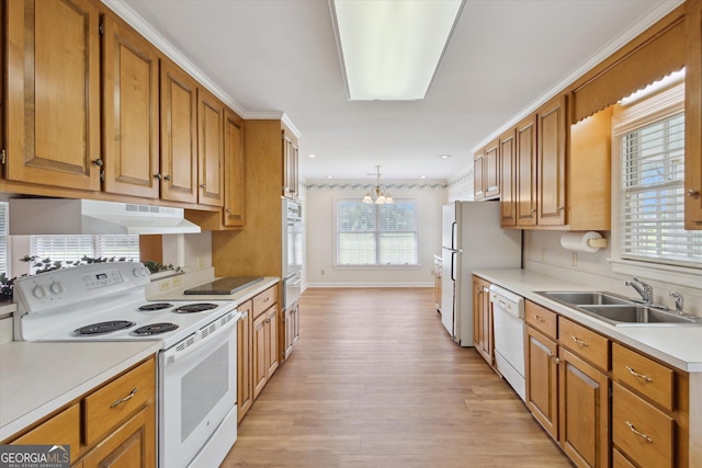 788 Buie Cir, Pembroke, GA 31321 - kitchen featuring white appliances, a chandelier, light wood-style flooring, light countertops, and brown cabinets
