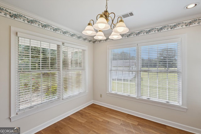 788 Buie Cir, Pembroke, GA 31321 - unfurnished dining area featuring a chandelier, plenty of natural light, wood finished floors, and recessed lighting