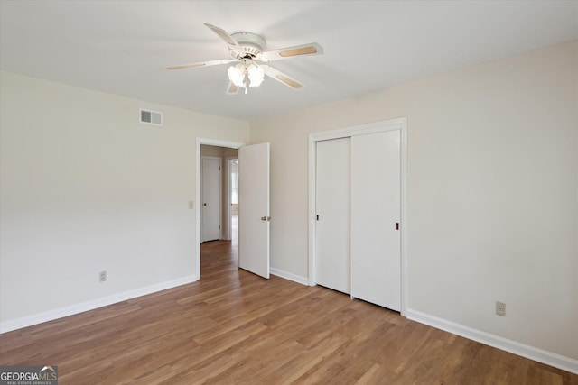 788 Buie Cir, Pembroke, GA 31321 - unfurnished bedroom with light wood-type flooring, a closet, and a ceiling fan