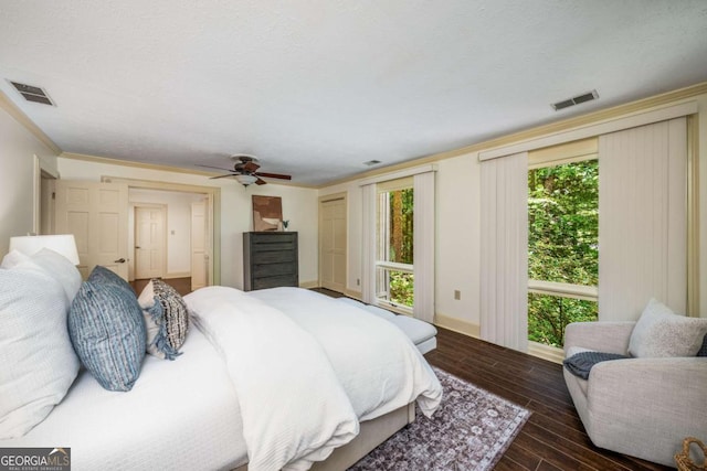 1690 Trotters Ln, Stone Mountain, GA 30087 - bedroom with wood finished floors, crown molding, and a ceiling fan