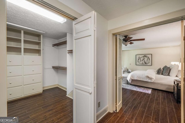 1690 Trotters Ln, Stone Mountain, GA 30087 - walk in closet with dark wood-style flooring and ceiling fan