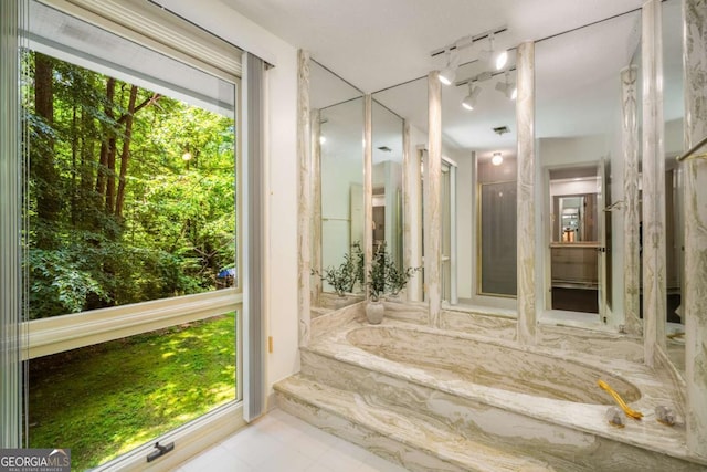 1690 Trotters Ln, Stone Mountain, GA 30087 - bathroom with a bath, tile patterned flooring, and rail lighting