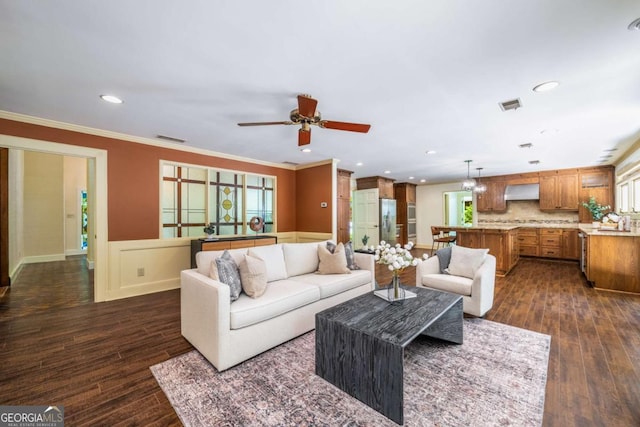 1690 Trotters Ln, Stone Mountain, GA 30087 - living area with dark wood-style flooring, a ceiling fan, ornamental molding, healthy amount of natural light, and recessed lighting