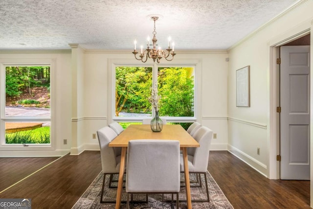 1690 Trotters Ln, Stone Mountain, GA 30087 - dining area featuring a chandelier, dark wood-style flooring, a textured ceiling, and ornamental molding