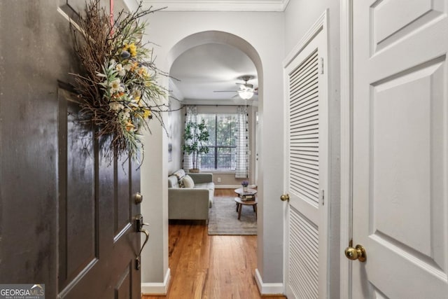 3777 Peachtree Rd NE Unit 1216, Atlanta, GA 30319 - hallway with light wood-style flooring, crown molding, and arched walkways