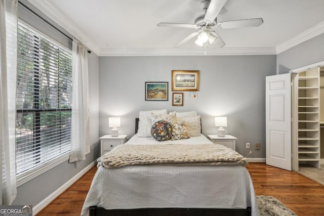 3777 Peachtree Rd NE Unit 1216, Atlanta, GA 30319 - bedroom featuring ornamental molding, dark wood-style floors, a spacious closet, and a ceiling fan
