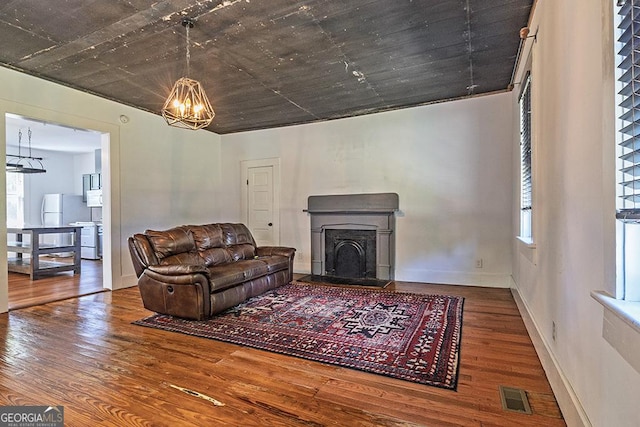 242 Hydrolia, Macon, GA 31217 - living room featuring a chandelier, wood finished floors, and plenty of natural light