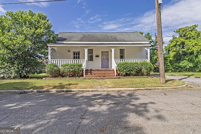 242 Hydrolia, Macon, GA 31217 - bungalow-style home featuring covered porch and a front lawn