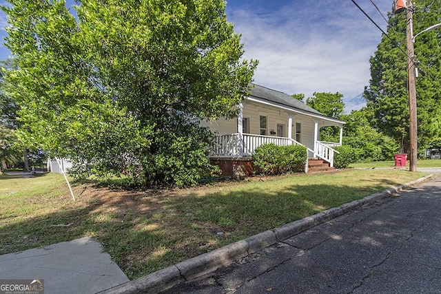 242 Hydrolia, Macon, GA 31217 - view of front of house with a porch and a front lawn