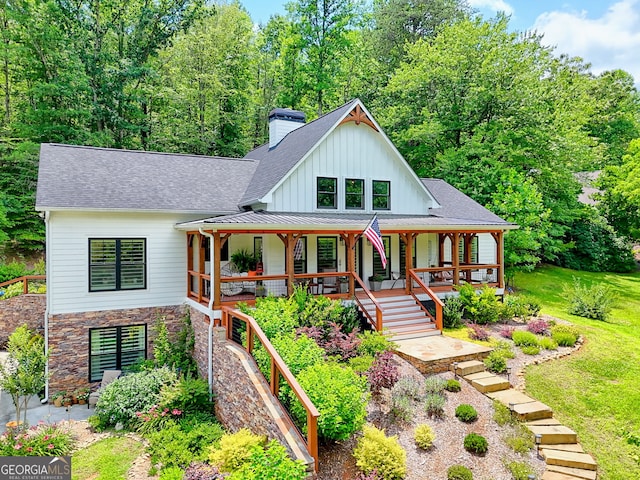 533 Ledford Rd, Dillard, GA 30537 - view of front of home with a porch, a chimney, a shingled roof, and stairway