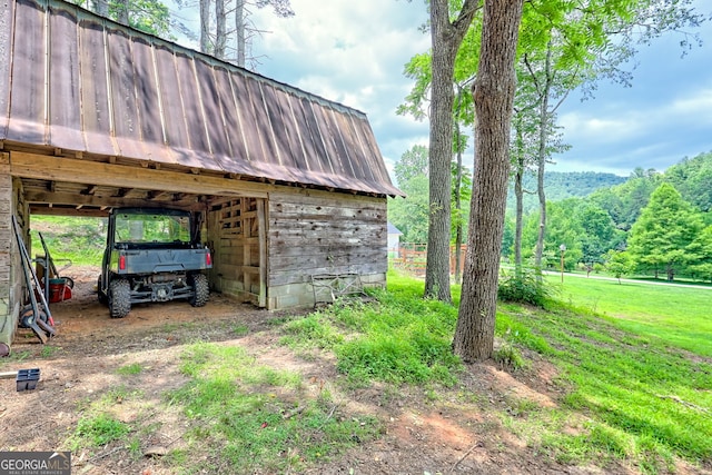 533 Ledford Rd, Dillard, GA 30537 - view of yard with an outdoor structure, a carport, and an outbuilding