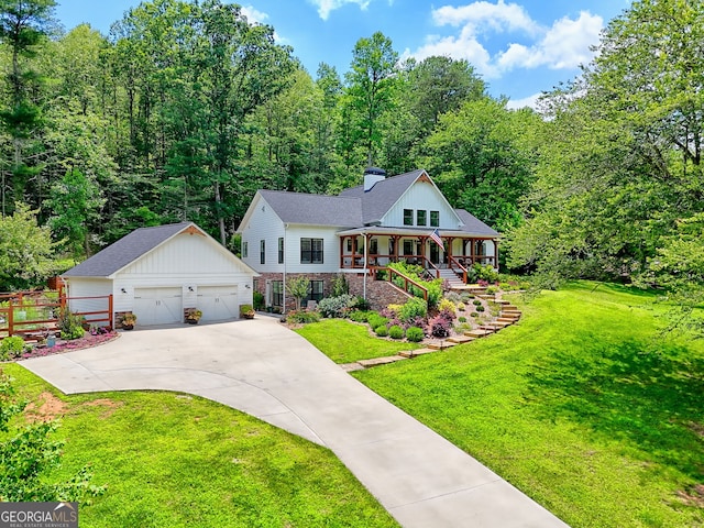 533 Ledford Rd, Dillard, GA 30537 - view of front of house with an outdoor structure, a porch, a detached garage, a chimney, and stairs