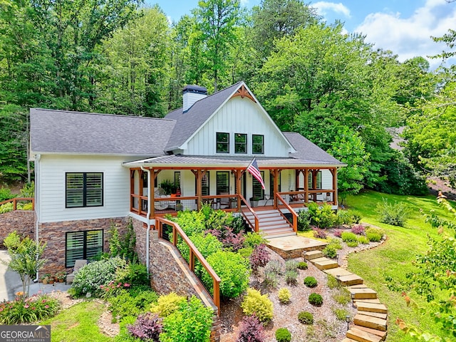 533 Ledford Rd, Dillard, GA 30537 - view of front facade with board and batten siding, a porch, a chimney, stairs, and roof with shingles