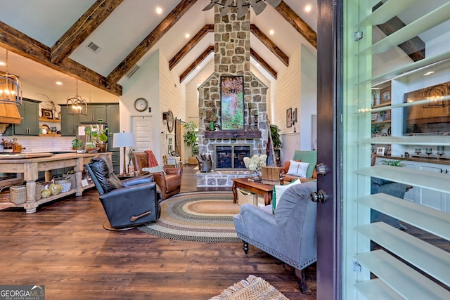 533 Ledford Rd, Dillard, GA 30537 - living area with beam ceiling, a fireplace, high vaulted ceiling, dark wood-type flooring, and a chandelier