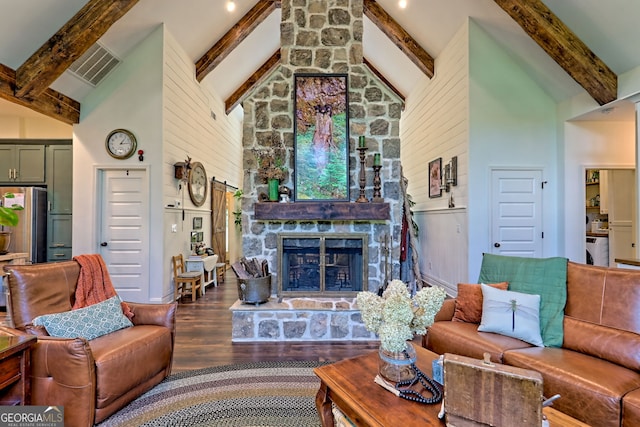 533 Ledford Rd, Dillard, GA 30537 - living room featuring wood finished floors, beamed ceiling, high vaulted ceiling, and a stone fireplace