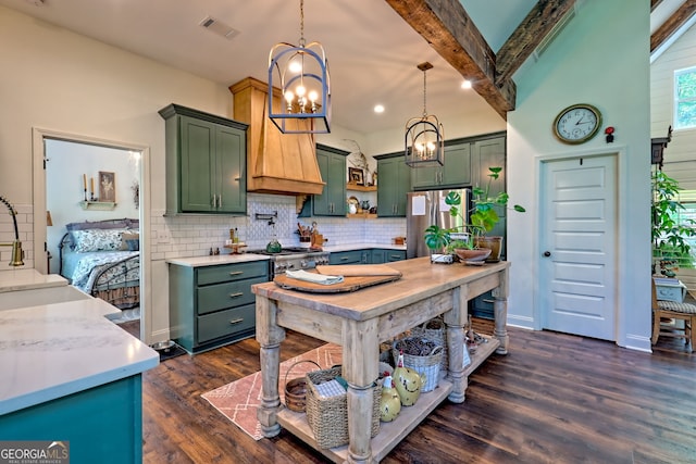 533 Ledford Rd, Dillard, GA 30537 - kitchen with green cabinets, a chandelier, freestanding refrigerator, tasteful backsplash, and recessed lighting