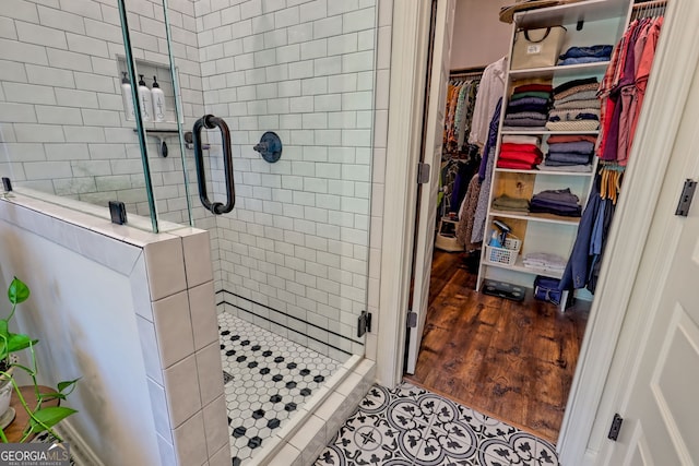 533 Ledford Rd, Dillard, GA 30537 - bathroom with a shower stall, a spacious closet, and tile patterned floors