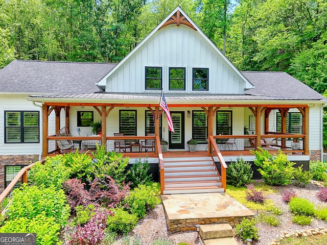 533 Ledford Rd, Dillard, GA 30537 - view of front of property featuring board and batten siding, a porch, roof with shingles, and stone siding