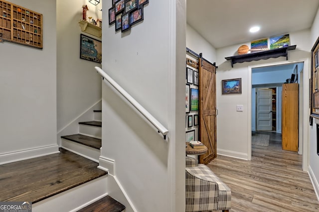 533 Ledford Rd, Dillard, GA 30537 - staircase with a barn door, wood finished floors, and recessed lighting
