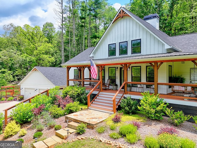 533 Ledford Rd, Dillard, GA 30537 - view of front of property with board and batten siding, a shingled roof, a porch, a chimney, and an outdoor structure