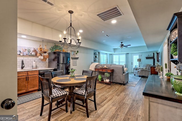 533 Ledford Rd, Dillard, GA 30537 - dining space with light wood-type flooring, a ceiling fan, recessed lighting, and a raised ceiling