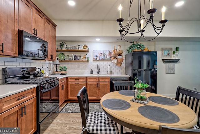 533 Ledford Rd, Dillard, GA 30537 - kitchen with black appliances, tasteful backsplash, light countertops, open shelves, and recessed lighting