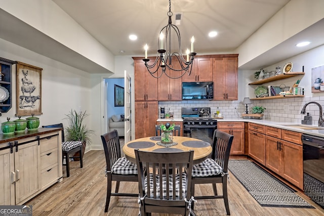 533 Ledford Rd, Dillard, GA 30537 - kitchen featuring black appliances, a chandelier, tasteful backsplash, light countertops, and open shelves