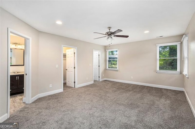 1856 Austell, Marietta, GA 30060 - unfurnished bedroom featuring light carpet, recessed lighting, a walk in closet, ensuite bath, and a ceiling fan