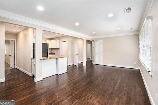 1856 Austell, Marietta, GA 30060 - unfurnished living room featuring dark wood finished floors, ornamental molding, and recessed lighting