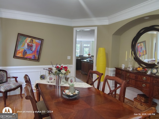 1292 Hidden Spirit Trl, Lawrenceville, GA 30045 - dining room with crown molding, light wood finished floors, and wainscoting