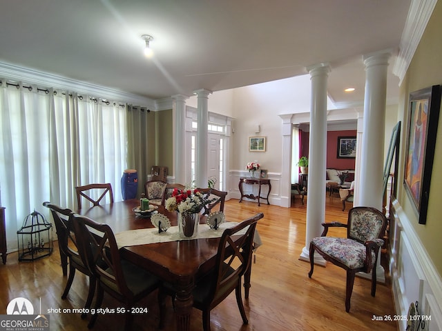 1292 Hidden Spirit Trl, Lawrenceville, GA 30045 - dining room with ornate columns, healthy amount of natural light, ornamental molding, and light wood finished floors