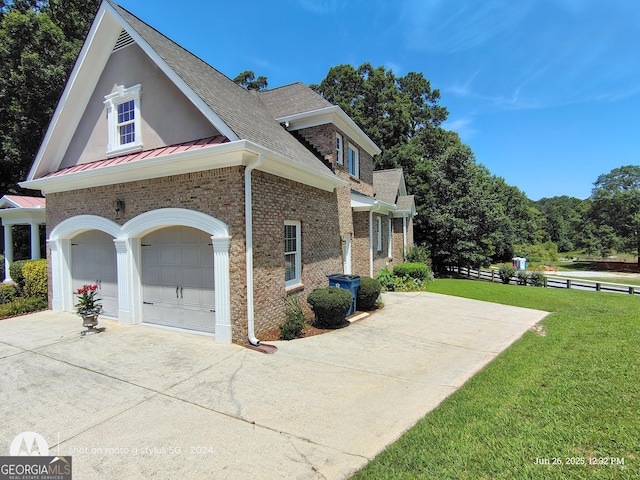 1292 Hidden Spirit Trl, Lawrenceville, GA 30045 - view of property exterior with concrete driveway, roof with shingles, brick siding, a garage, and a standing seam roof