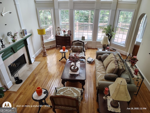 1292 Hidden Spirit Trl, Lawrenceville, GA 30045 - living area with wood finished floors, healthy amount of natural light, and a fireplace