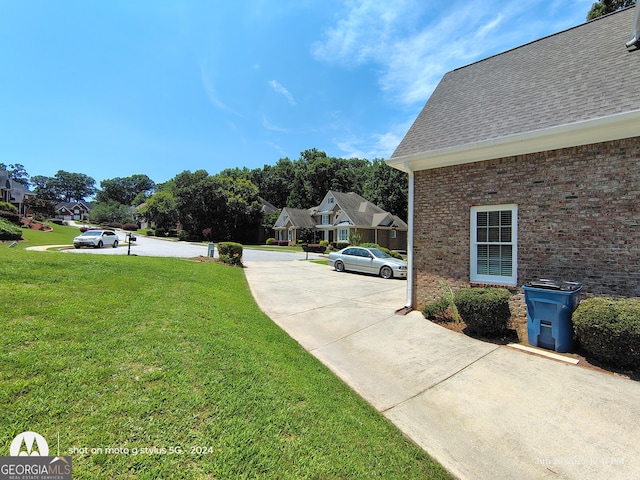 1292 Hidden Spirit Trl, Lawrenceville, GA 30045 - view of green lawn featuring a residential view and concrete driveway