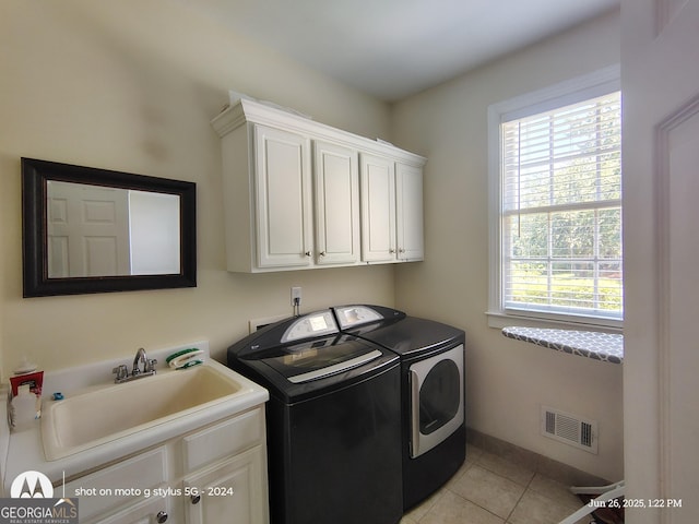 1292 Hidden Spirit Trl, Lawrenceville, GA 30045 - washroom with independent washer and dryer, cabinet space, healthy amount of natural light, and light tile patterned floors