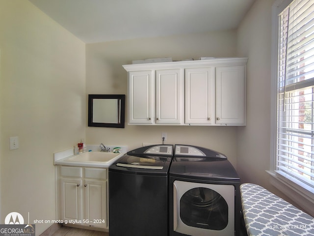 1292 Hidden Spirit Trl, Lawrenceville, GA 30045 - laundry area featuring cabinet space and independent washer and dryer