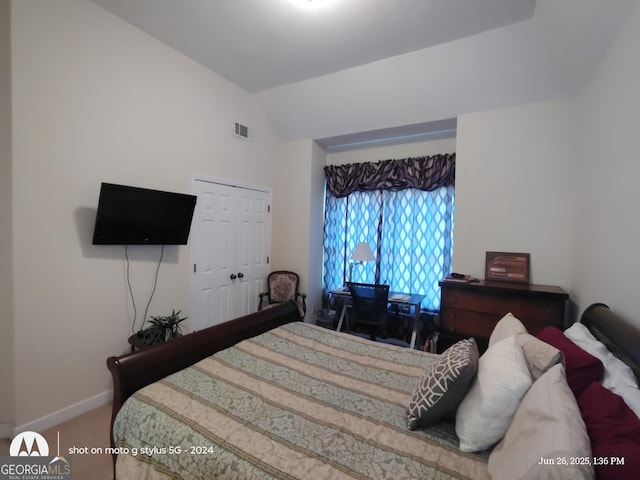 1292 Hidden Spirit Trl, Lawrenceville, GA 30045 - carpeted bedroom with lofted ceiling and a closet