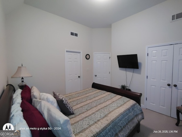 1292 Hidden Spirit Trl, Lawrenceville, GA 30045 - carpeted bedroom featuring a closet and vaulted ceiling