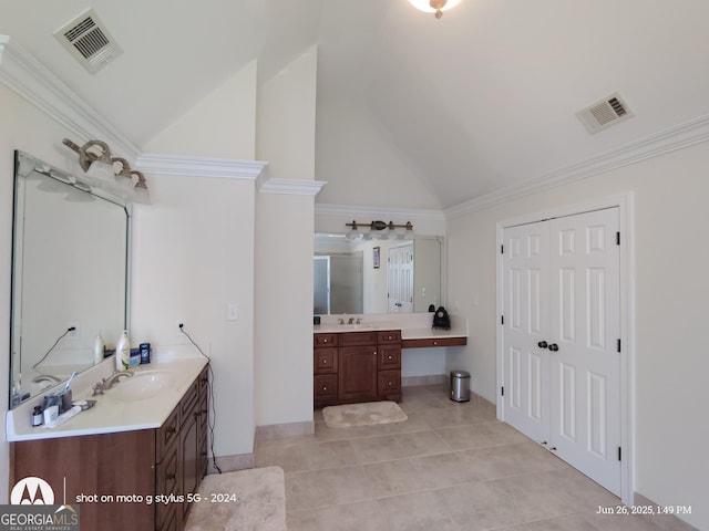 1292 Hidden Spirit Trl, Lawrenceville, GA 30045 - bathroom with two vanities, tile patterned flooring, high vaulted ceiling, and crown molding