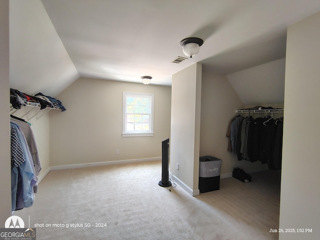 1292 Hidden Spirit Trl, Lawrenceville, GA 30045 - walk in closet featuring lofted ceiling and carpet floors