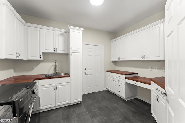 5455 Malone Ct, Powder Springs, GA 30127 - laundry room with cabinet space and a desk